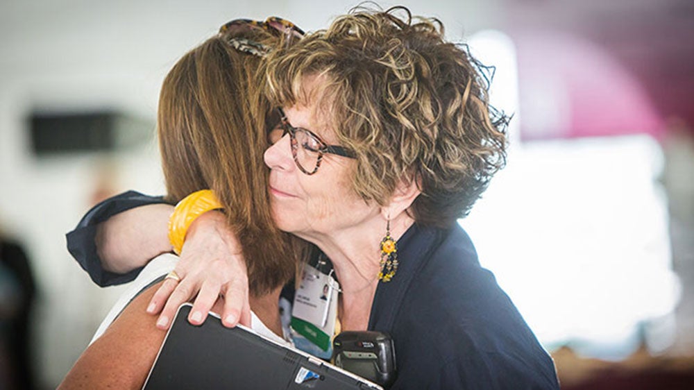 woman hugging someone