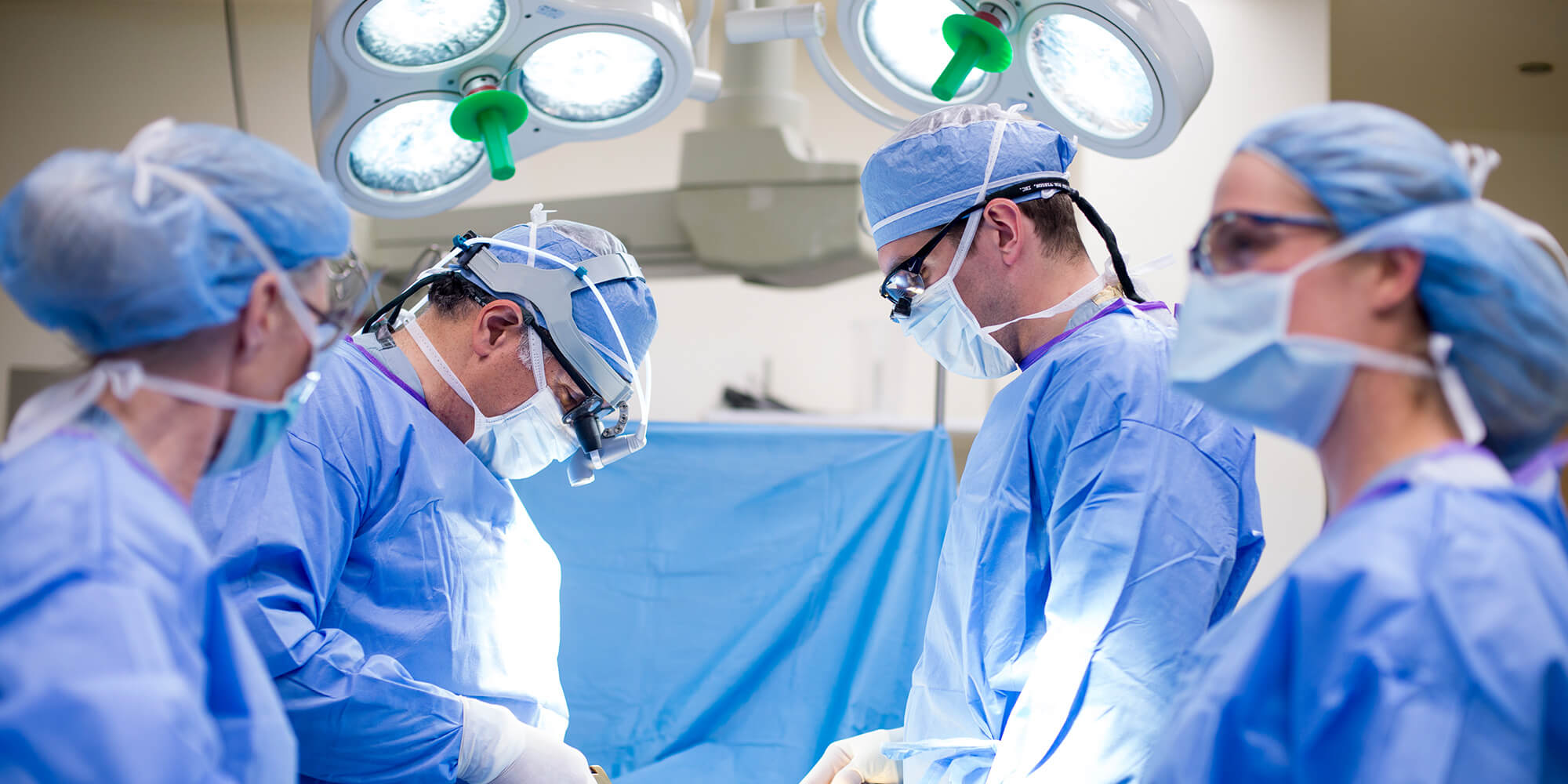 Surgeons and nurses in operating room