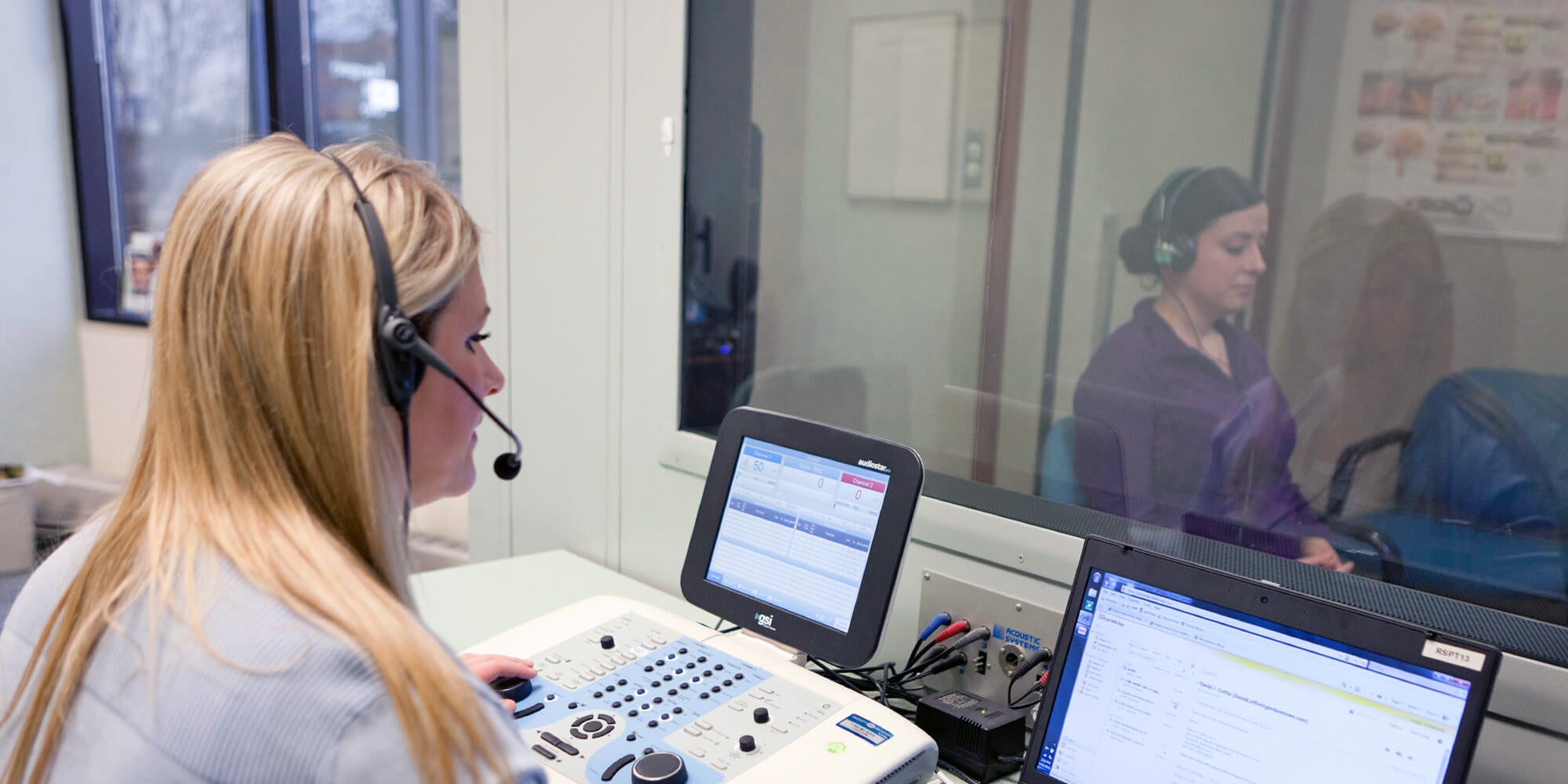 Audiologist with patient
