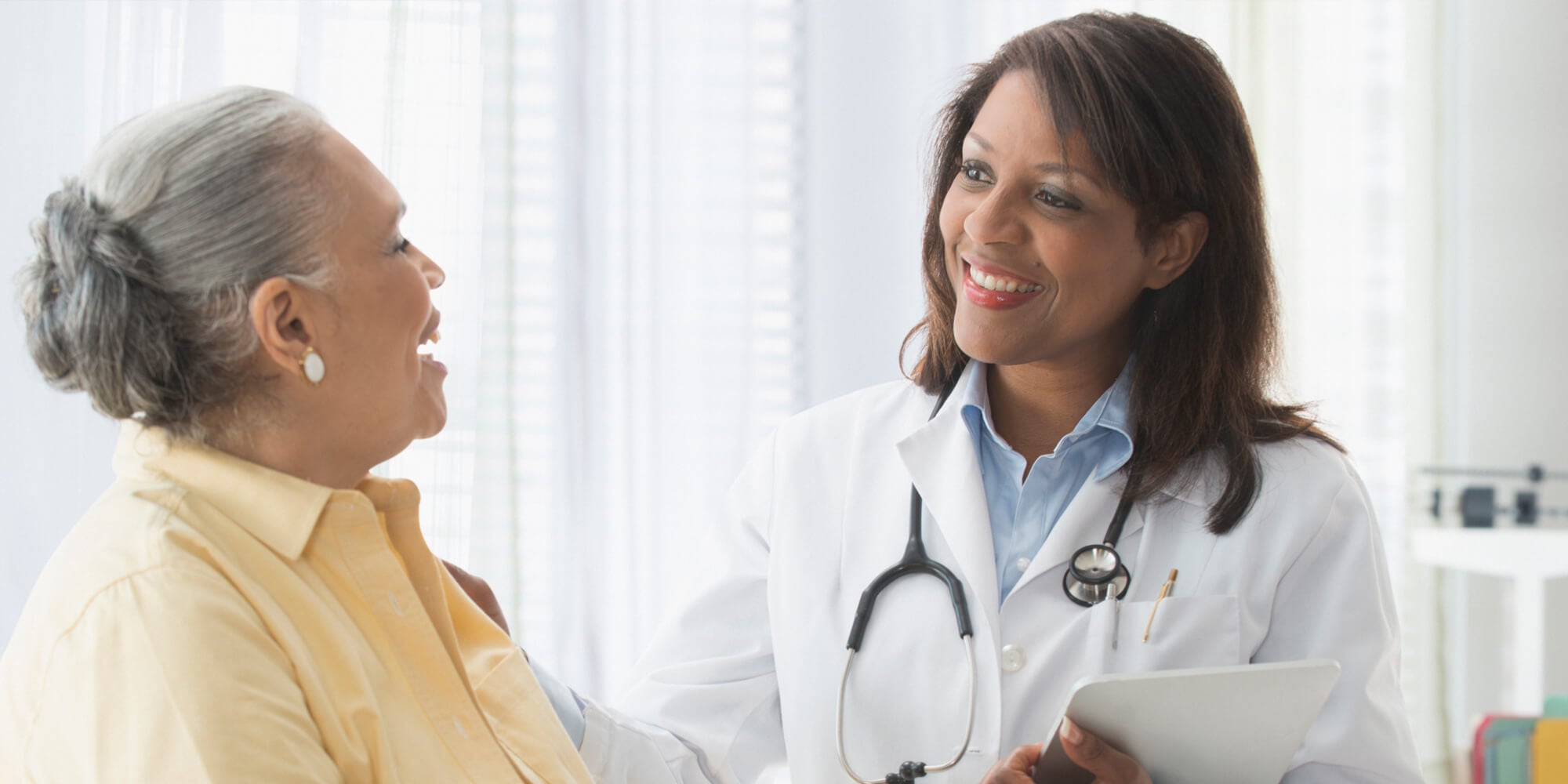 Female doctor with female patient