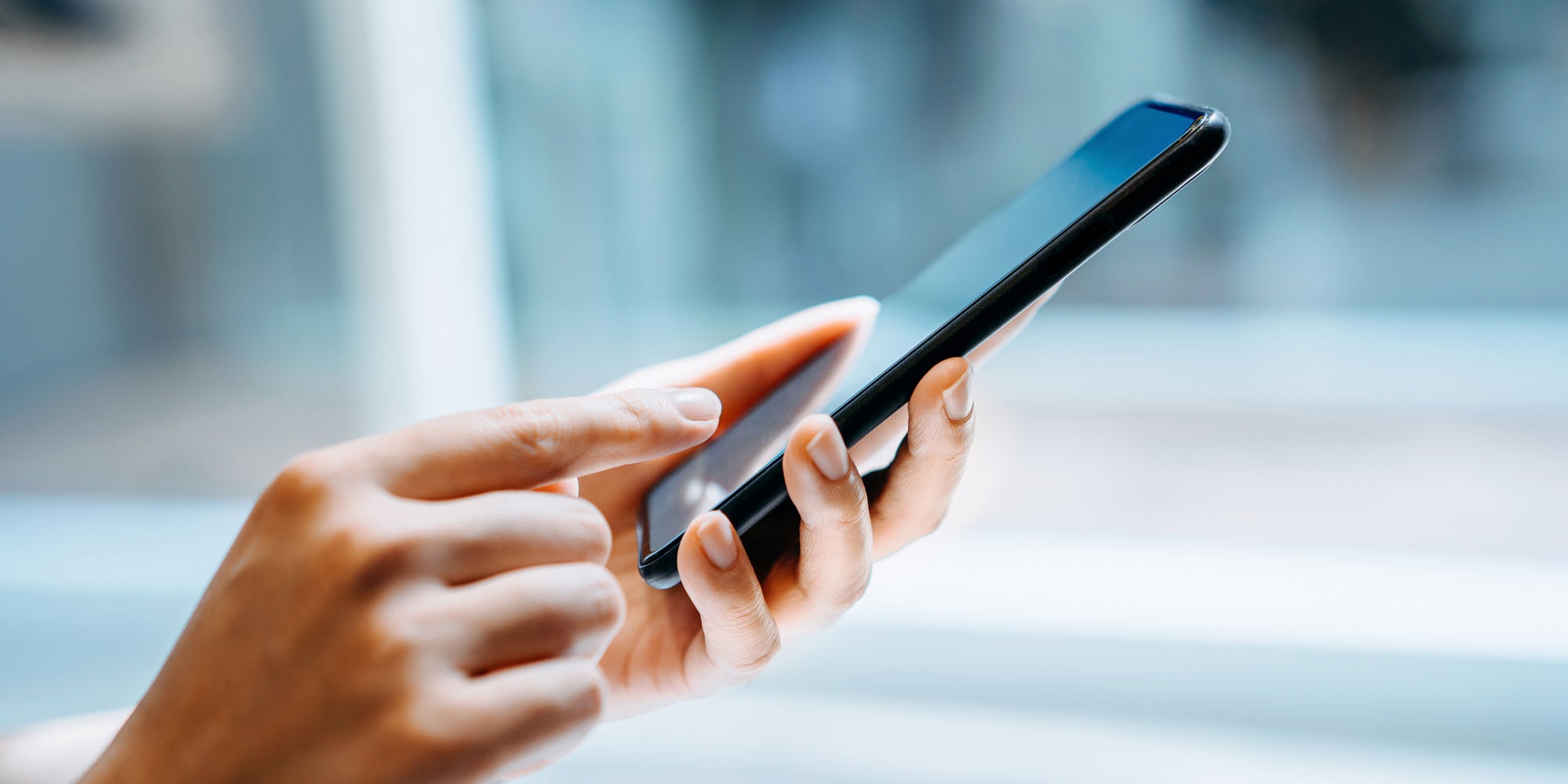 Image of person holding a smartphone