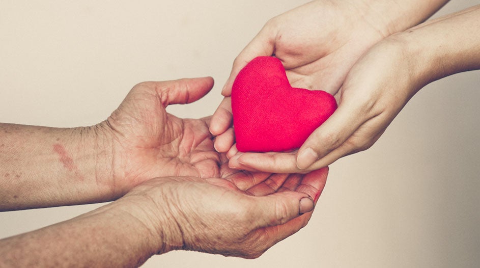 Hands holding a heart