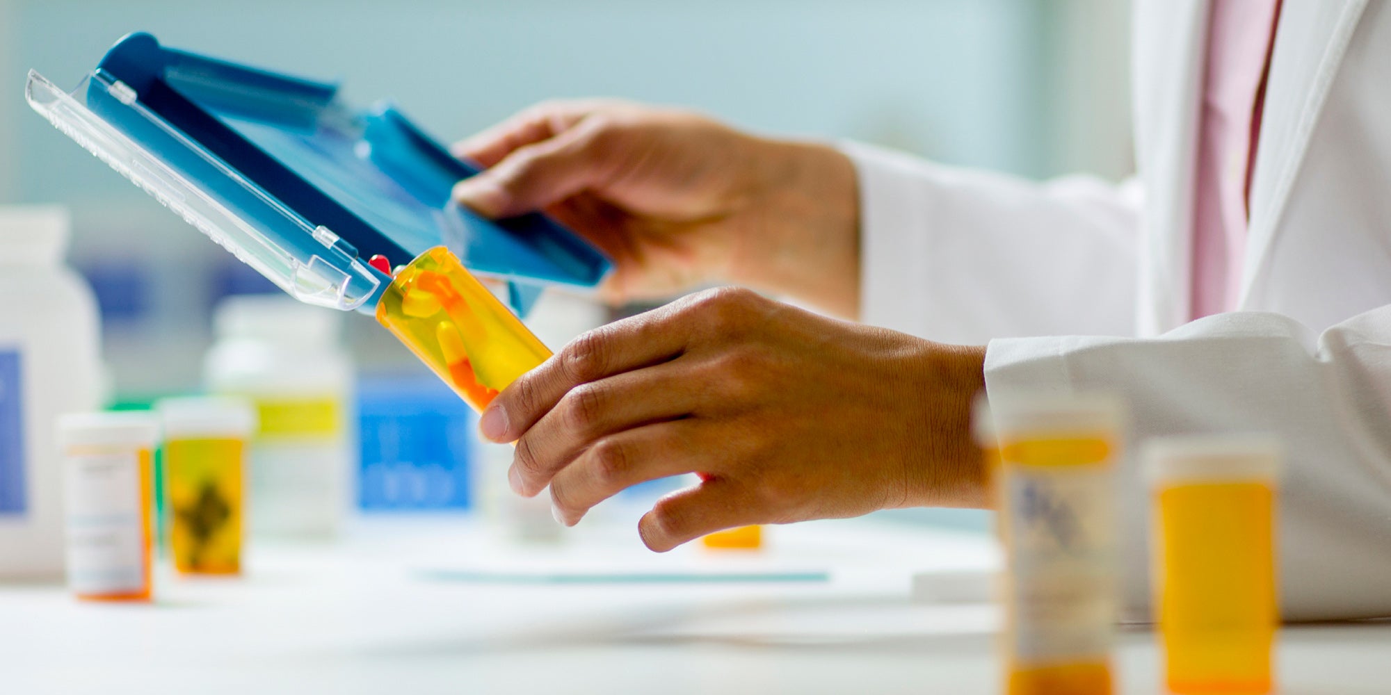 Pharmacy technician typing on screen