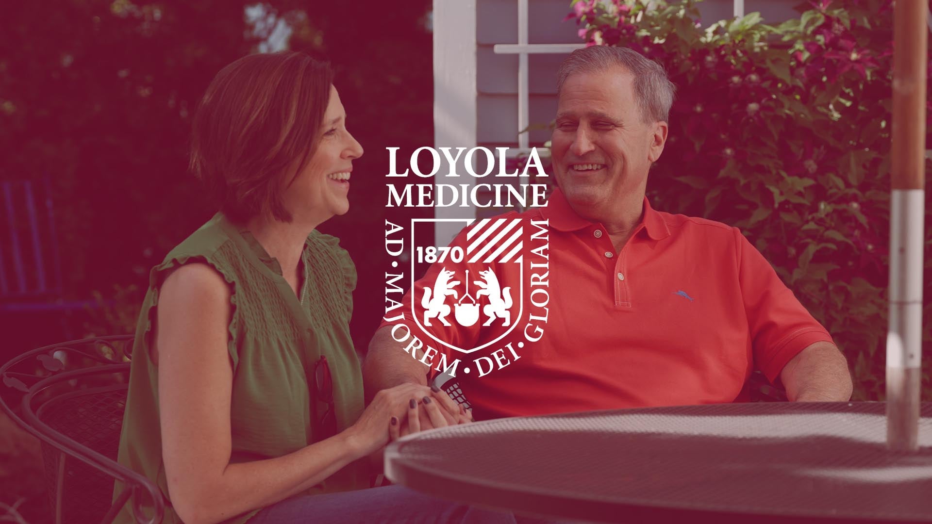 Patient and wife holding hands