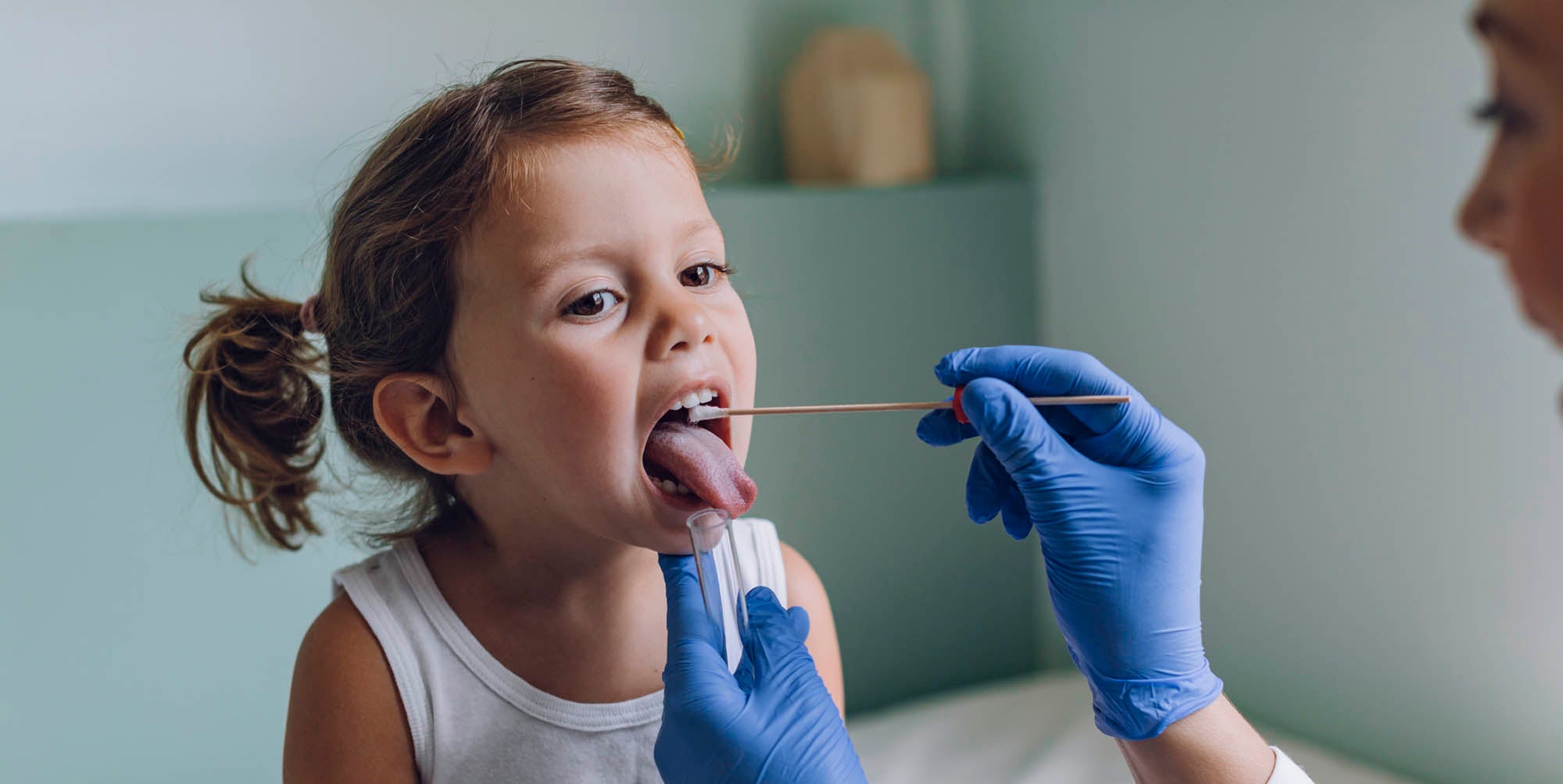 Doctor checking a child's mouth