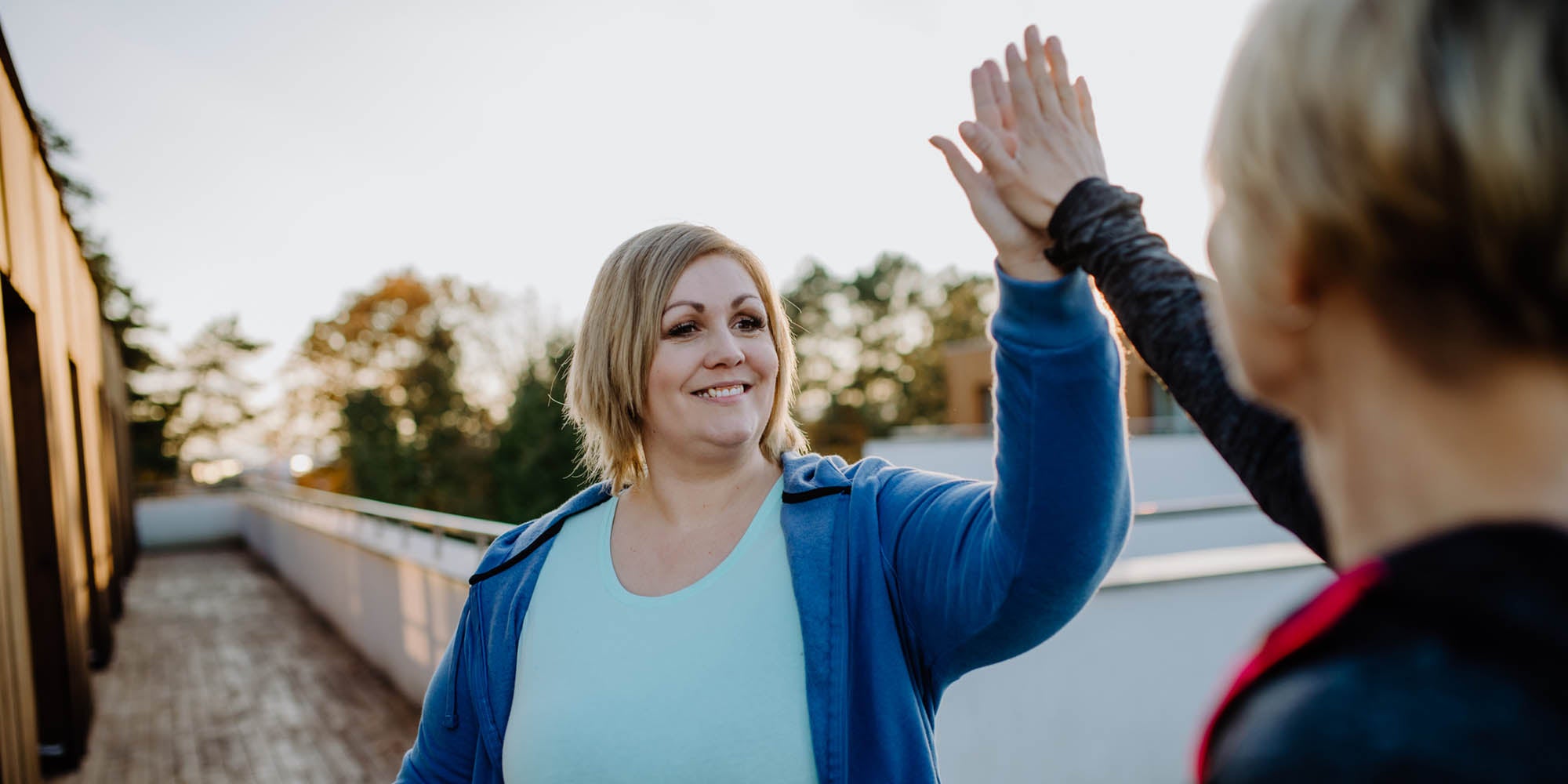 Woman high fiving a friend