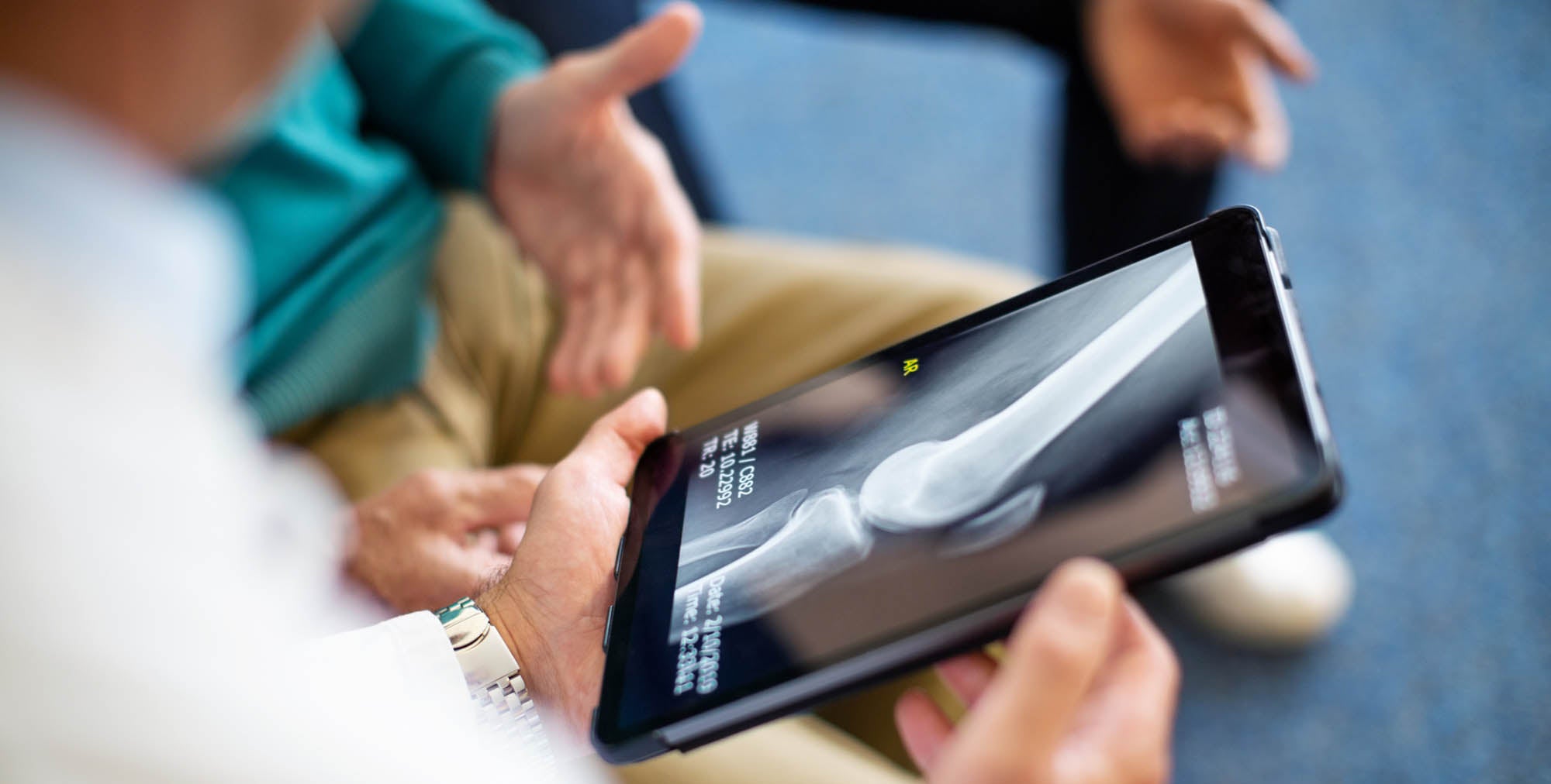 Doctor reviewing x-ray on a tablet