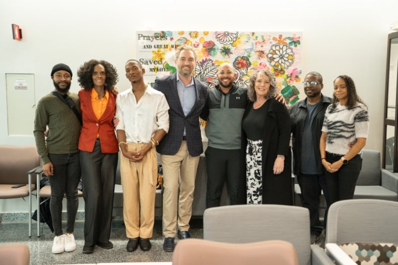 Damon, Syeed, Dr. Hagen and families pose for a photo