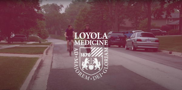 Greg Jones and son riding bikes. He is a Loyola patient who needed a life-saving surgery after a serious car accident