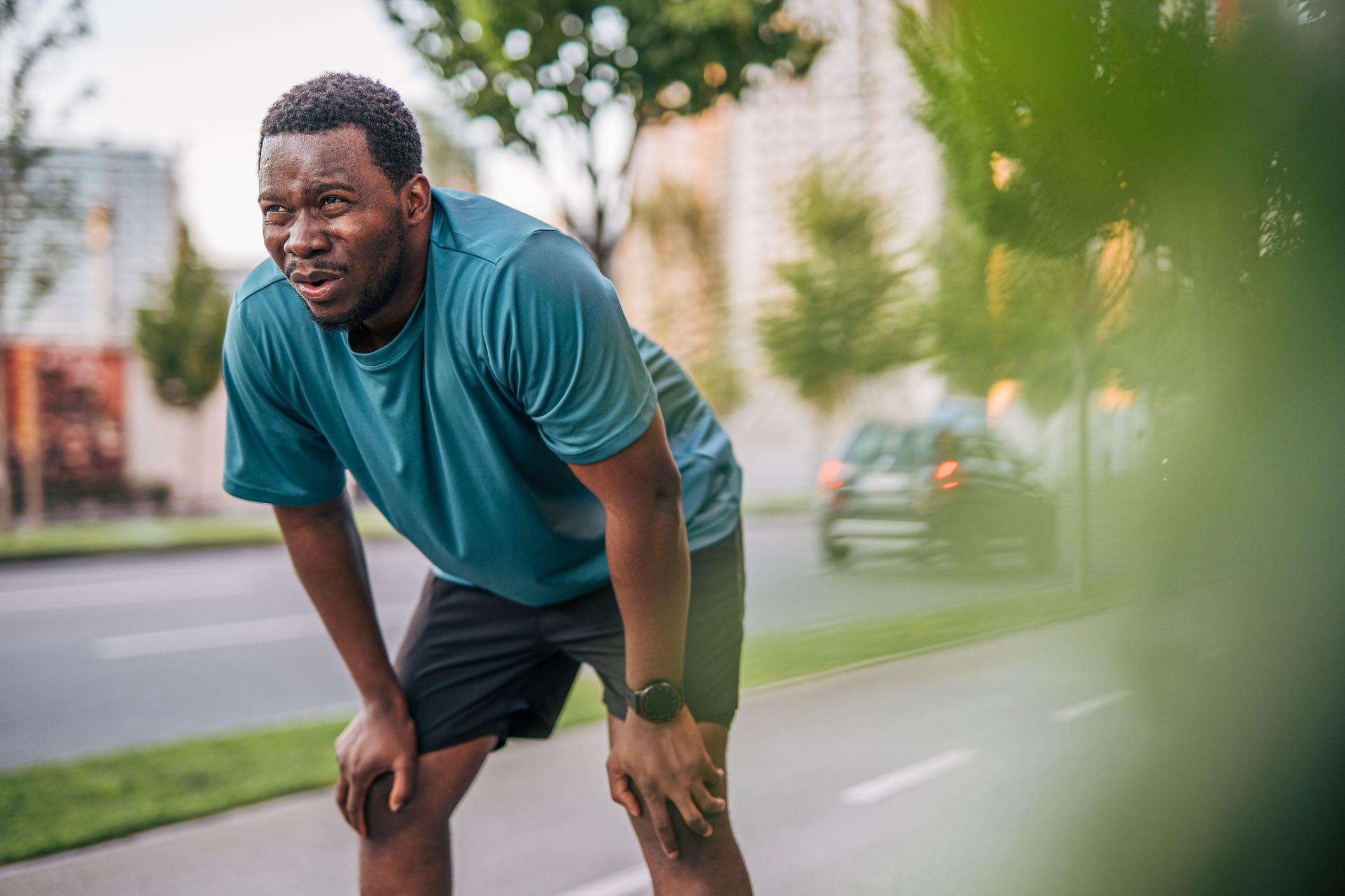 Man experiencing difficulty breathing while exercising