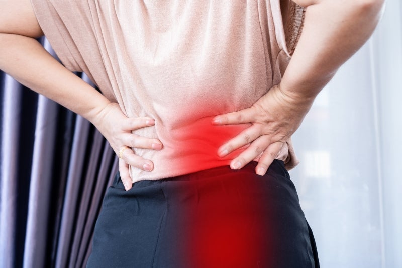Person experiencing sciatica pain