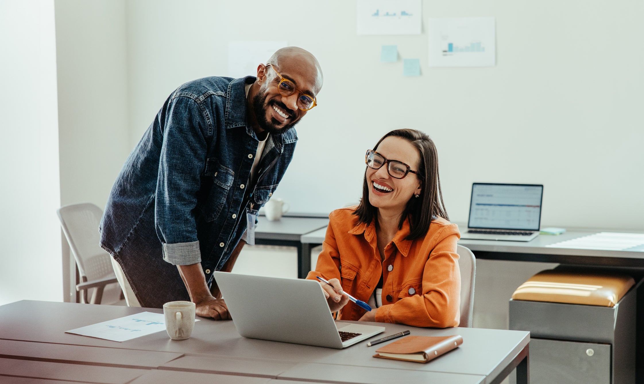 Man and women excited to learn about the benefits and perks of working at Loyola
