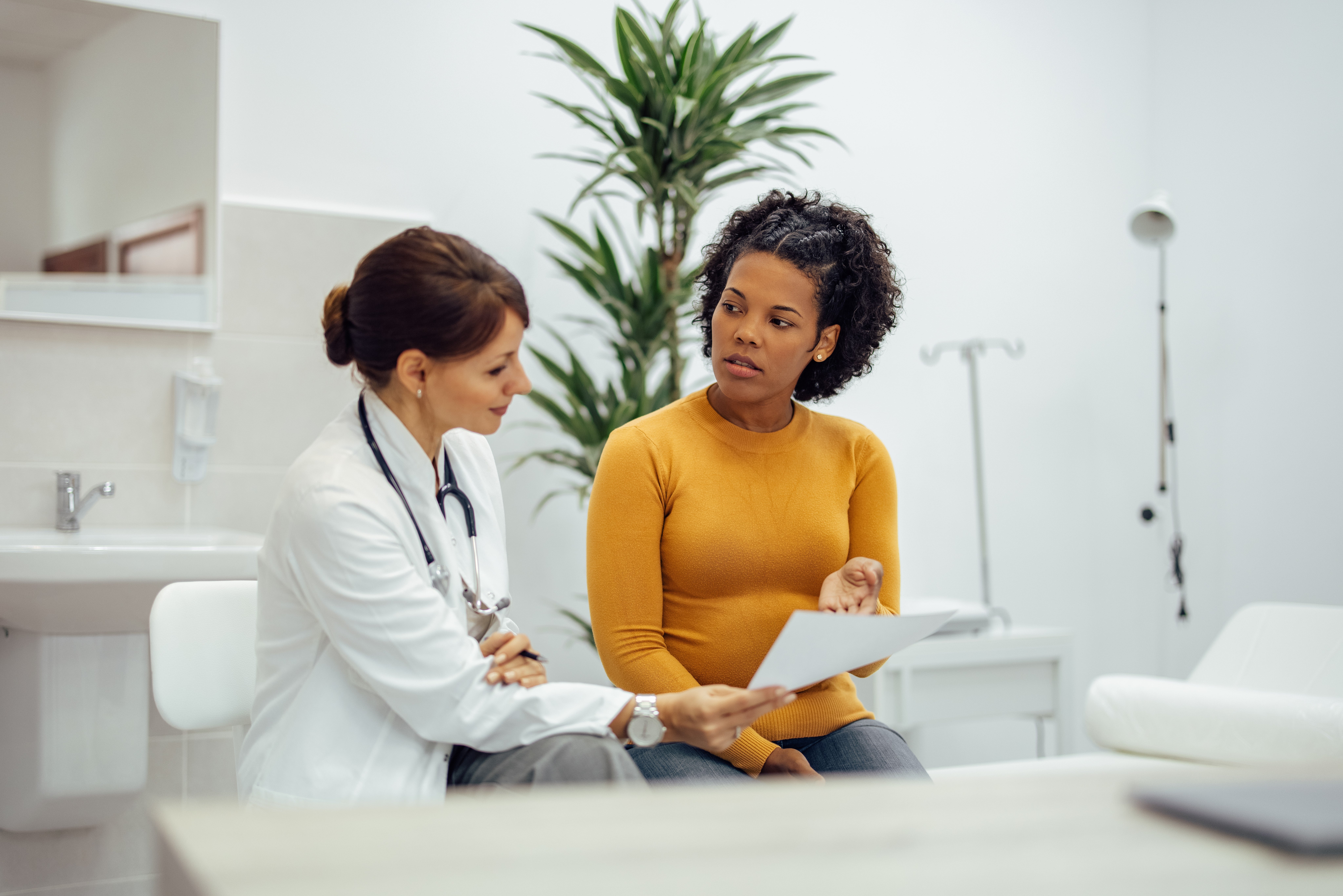 Physician speaking with patient