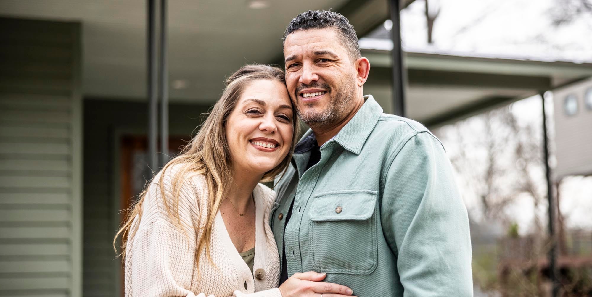 A couple embracing outside