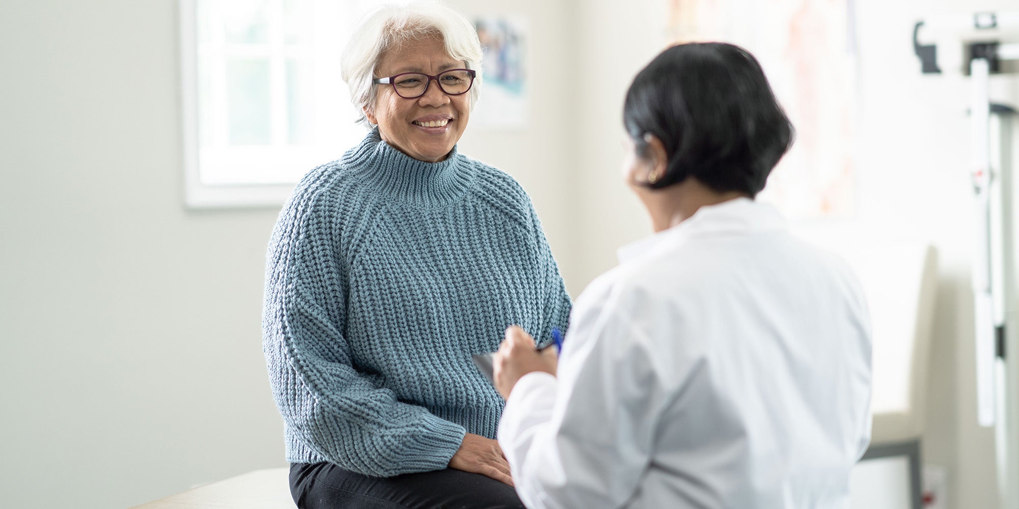 Patient speaking to doctor in doctor's office
