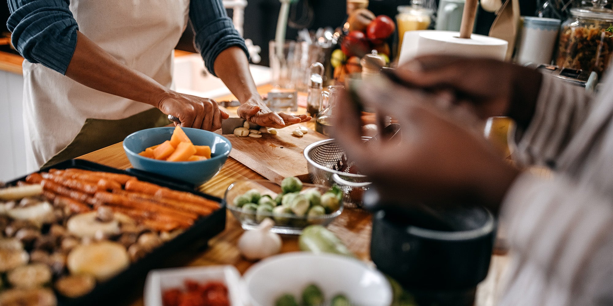 Two people cooking in a kitchen
