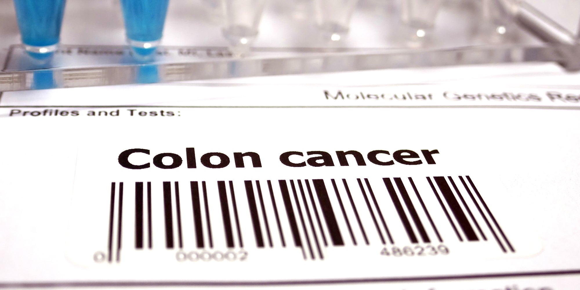 Paper with barcode and colon cancer typed on it