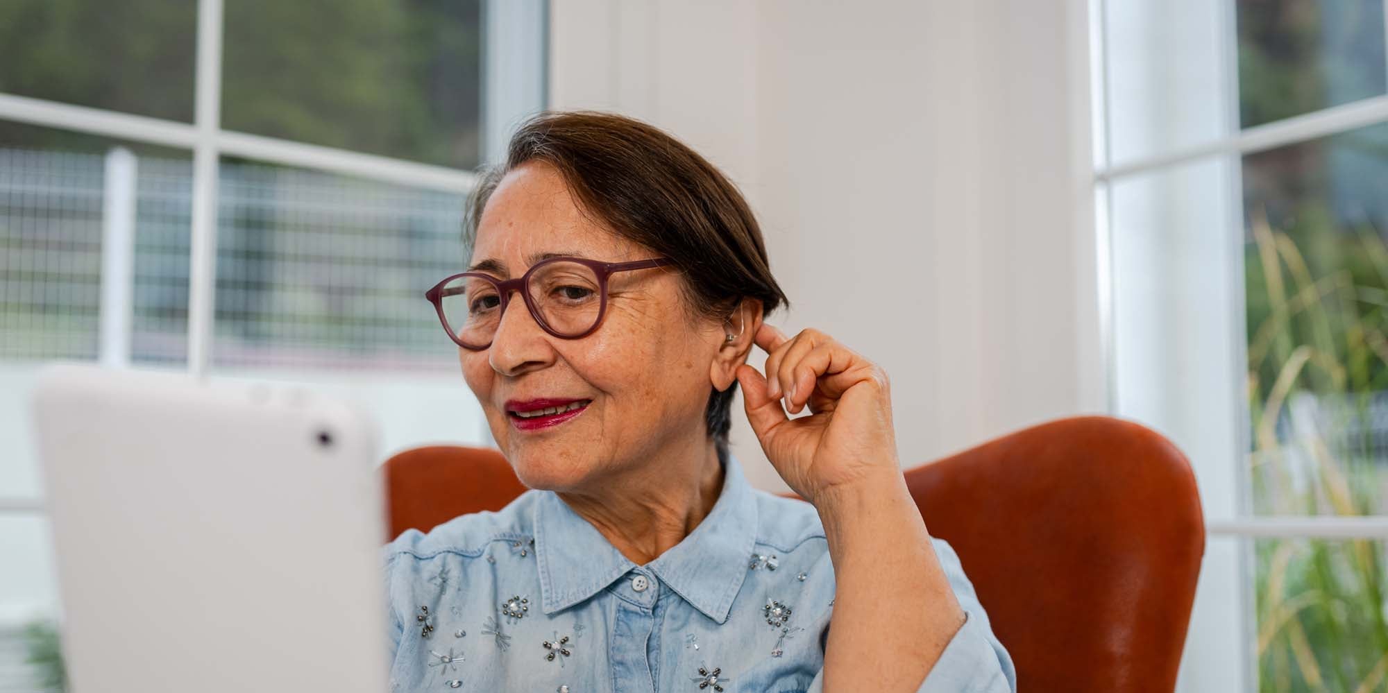 Woman with hearing loss on the phone