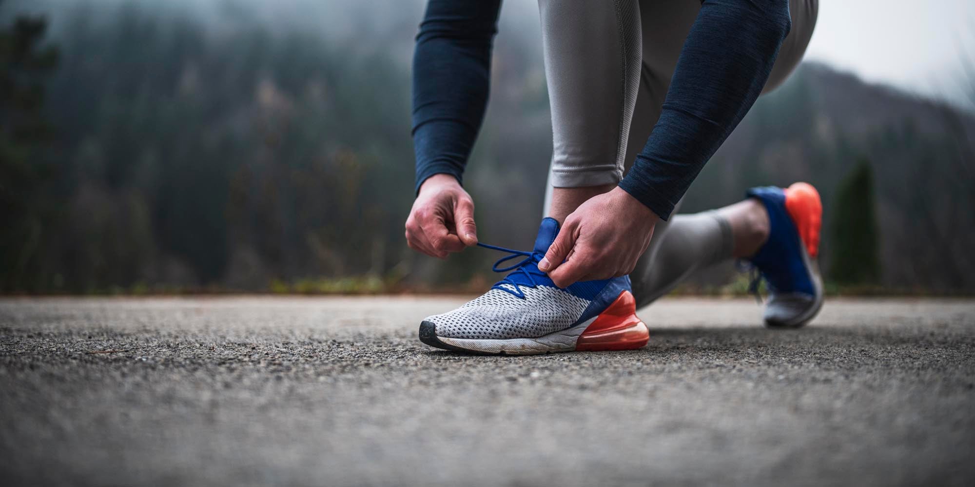 Runner tying his shoes