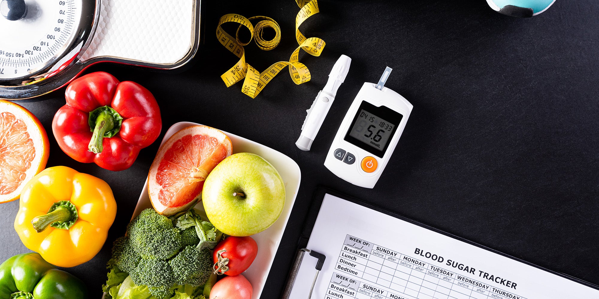 Healthy food and a blood sugar monitor