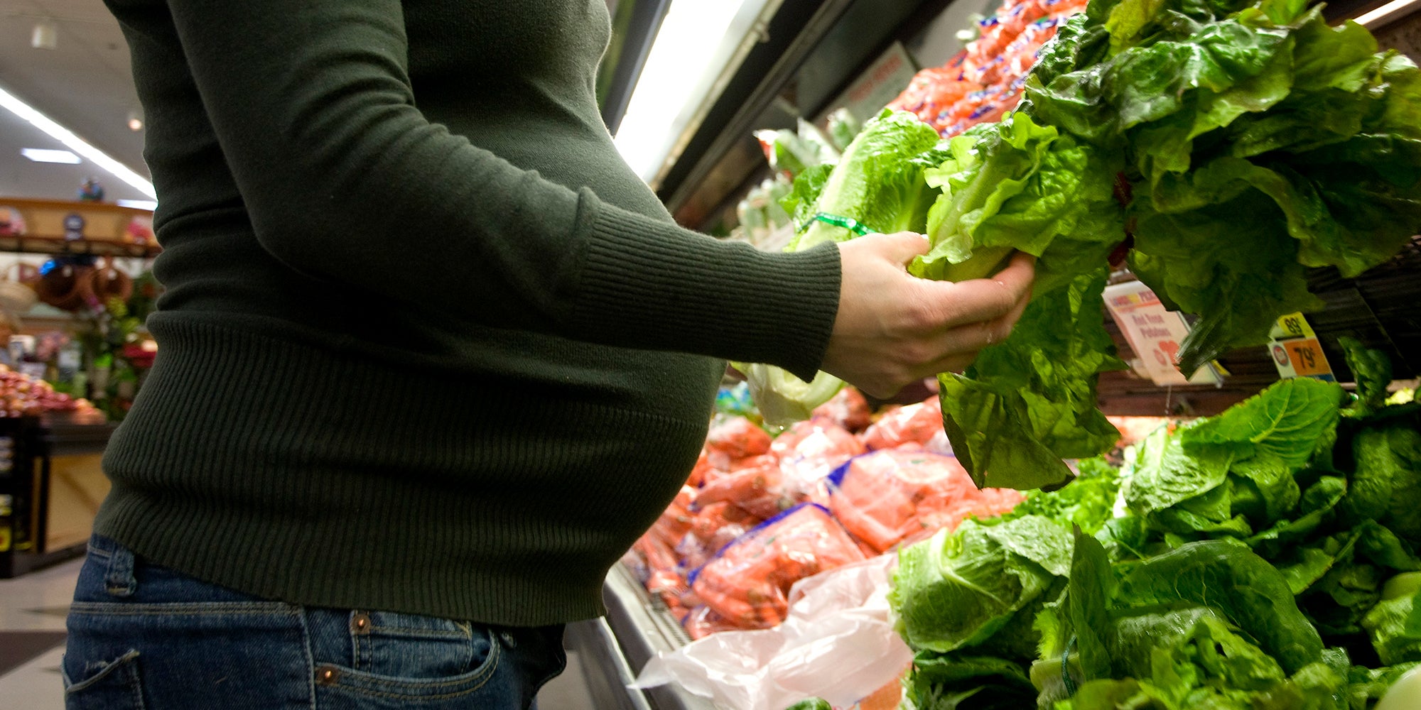 Pregnant woman grocery shopping