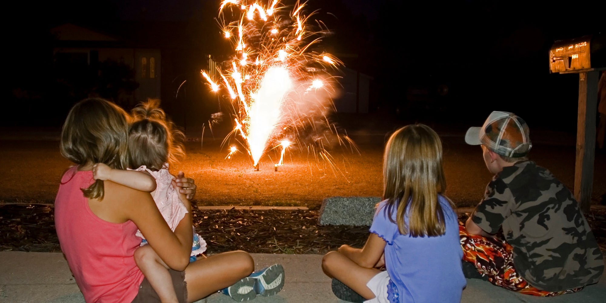 Family watching at-home fireworks