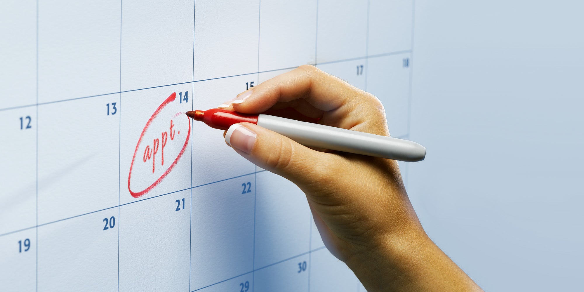 hand writing appointment on calendar