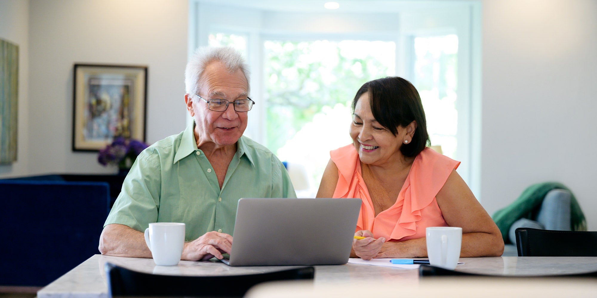 Older couple at home on computerOlder couple at home on computer