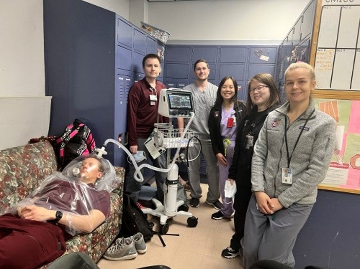 group surrounding patient